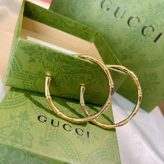 Boucles d'oreilles acier doré GUCCI