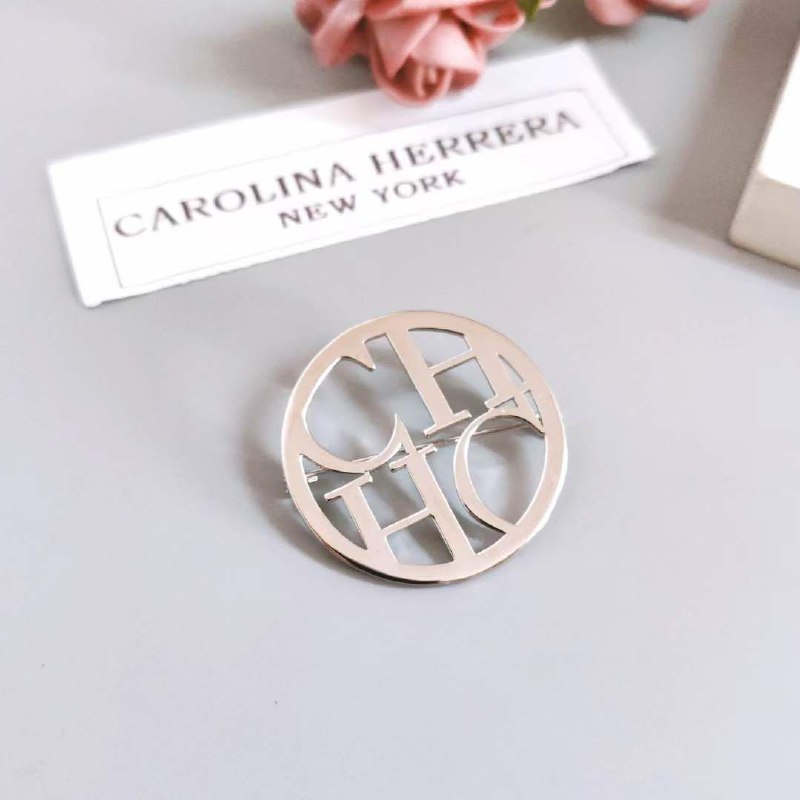 Broche acier CAROLINA HERRERA