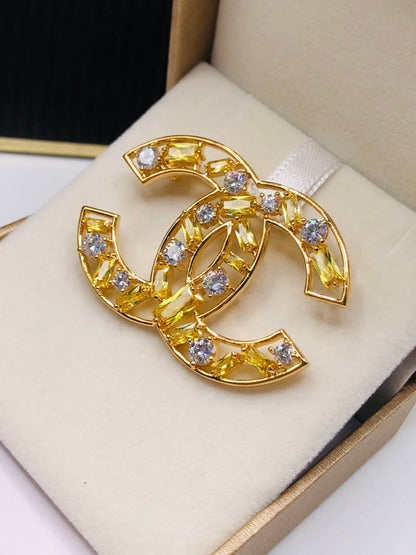 Broche doré CHANEL