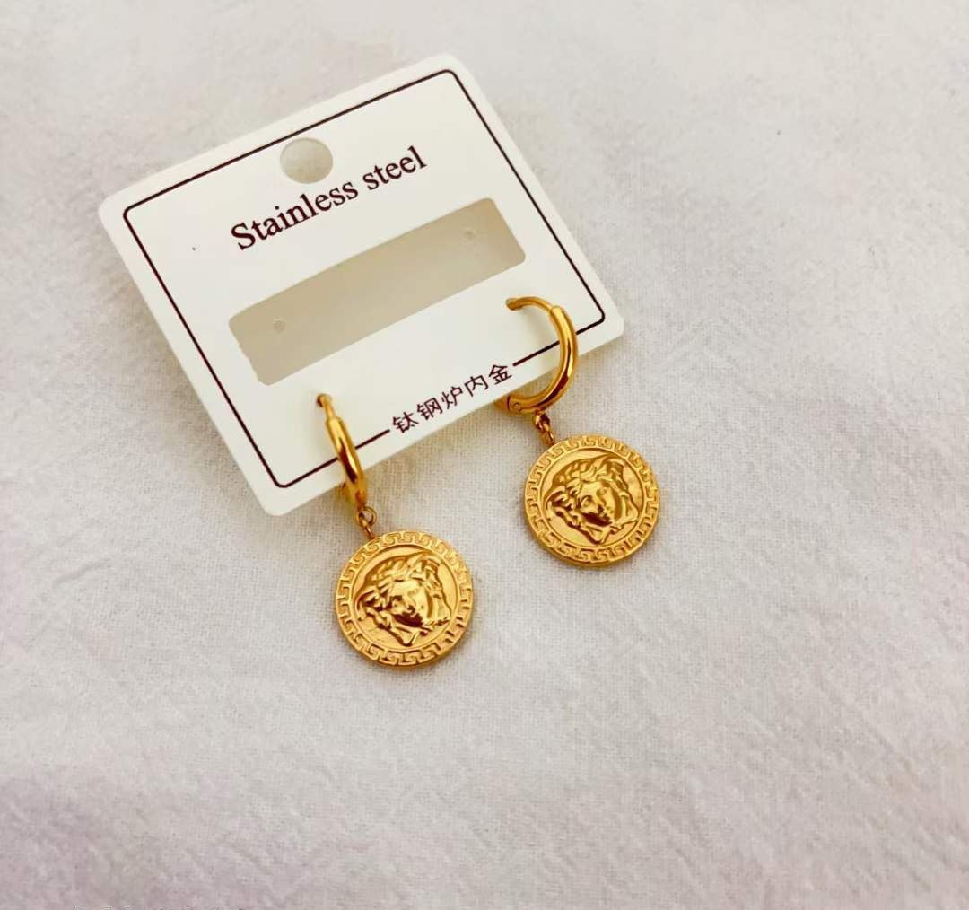 Boucles d'oreilles acier doré VERSACE