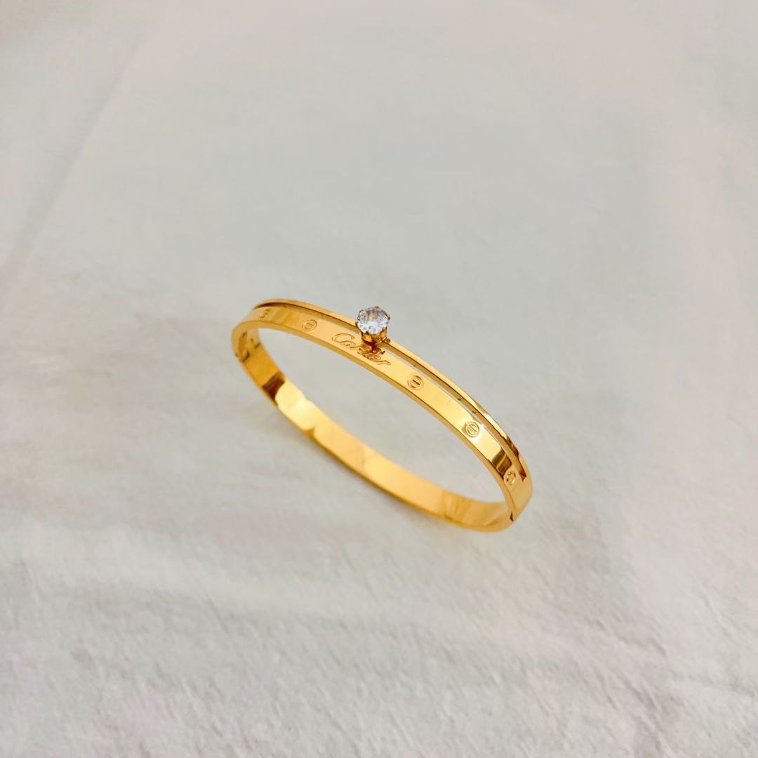Bracelet femme acier doré Cartier mariage