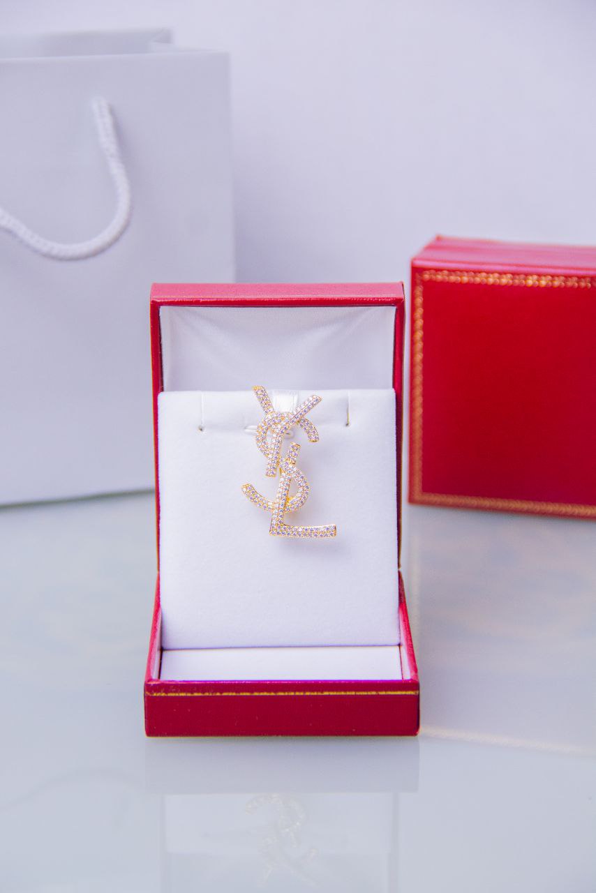 Broche doré Yves Saint Laurent