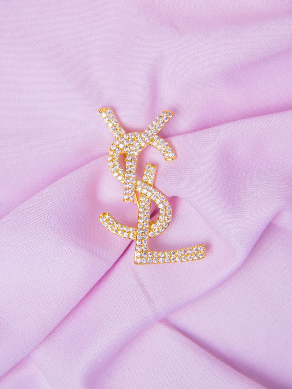 Broche doré Yves Saint Laurent