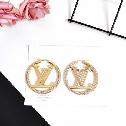 Boucles d'oreilles LOUIS VUITTON strass