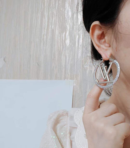 Boucles d'oreilles LOUIS VUITTON strass